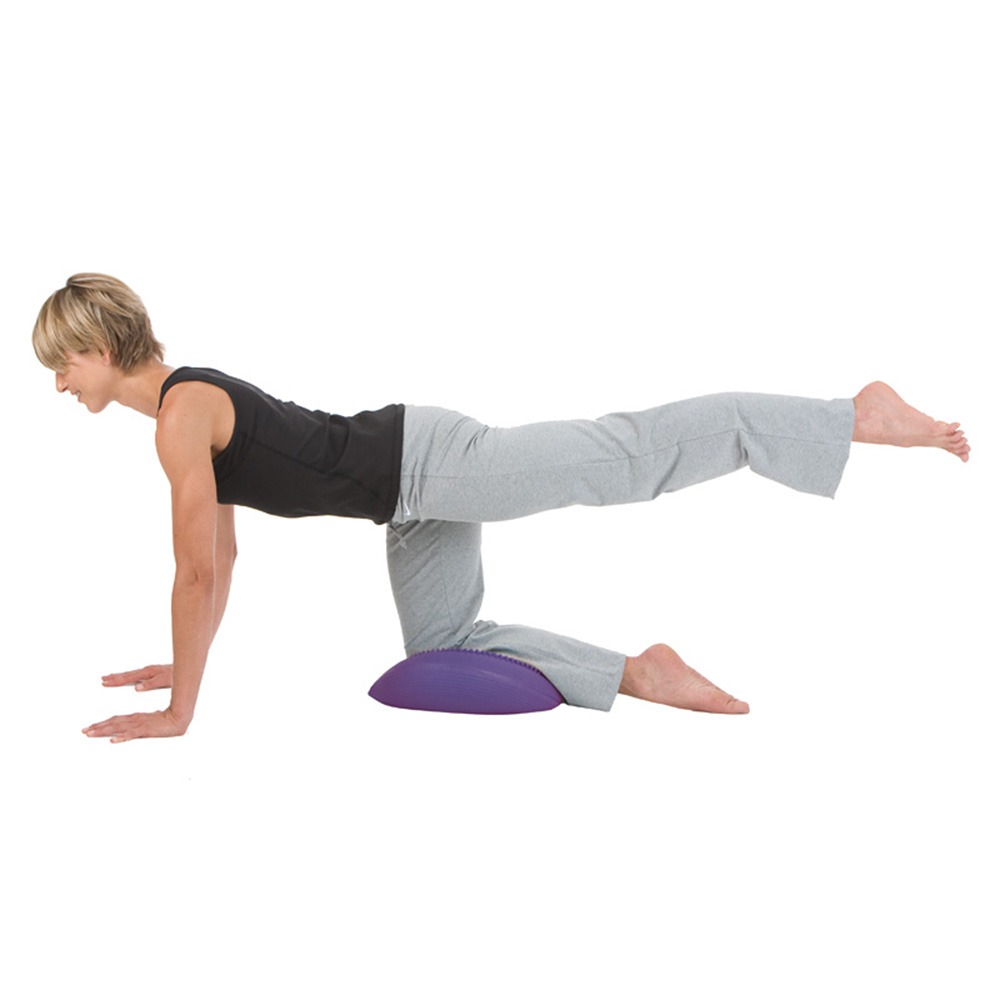 woman doing sit disk leg extensions