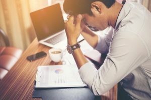 Man slouching while working at desk